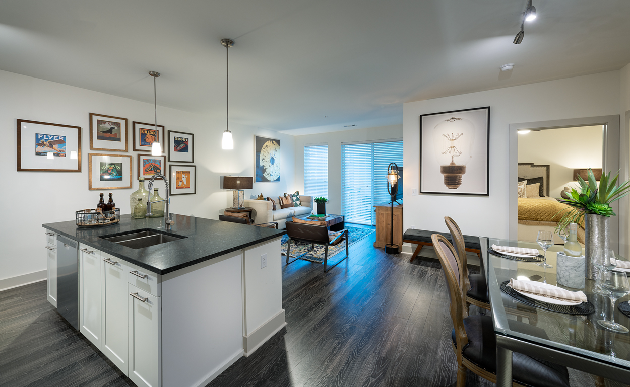 Cirro luxury apartment in King of Prussia, PA, showing an open kitchen connected to dining & living rooms